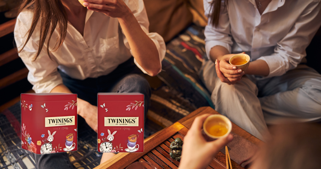 A cozy tea setup featuring Twinings Lady Grey, a steaming teacup, and citrus fruits for a zesty vibe.