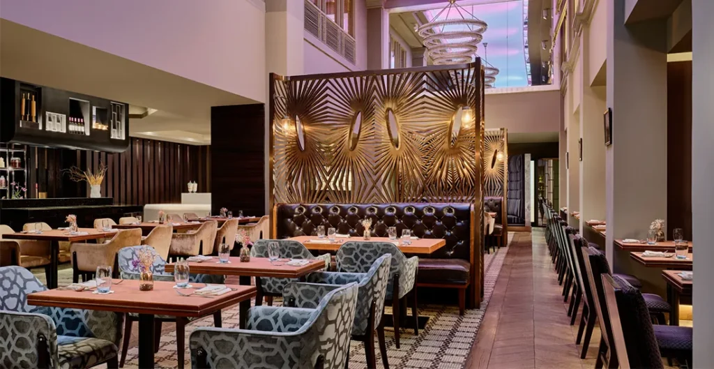 The warm and inviting ambiance of LUCE, featuring stylish decor, soft lighting, and a cozy dining atmosphere perfect for enjoying an authentic Italian feast.